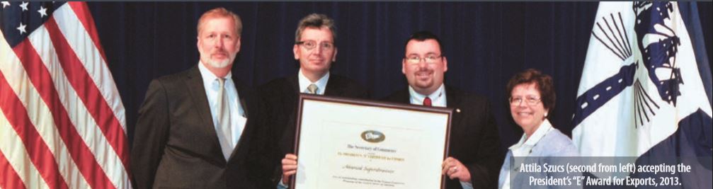 Attila Szucs accepting the President's "E" Award for Exports, 2013